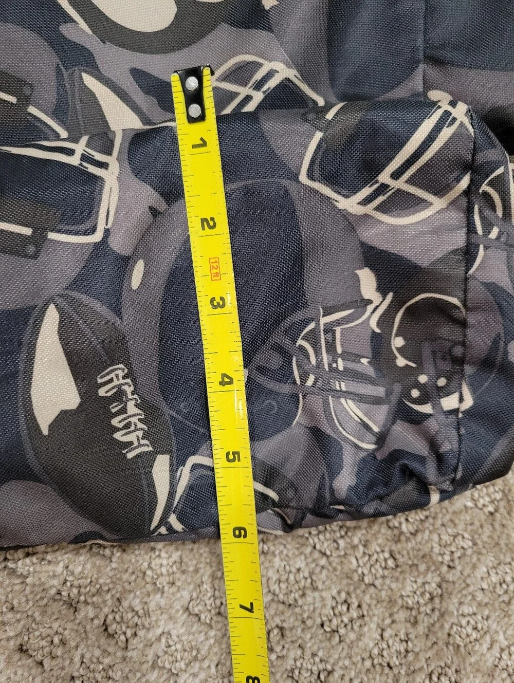 Double handle bag, snap closure, flat bottom, football pattern, like new